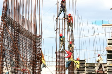 people working on building during daytime