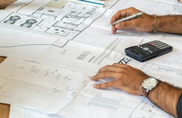 person writing on white paper